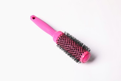 Photo of Hairdresser tool. Round pink brush on white background