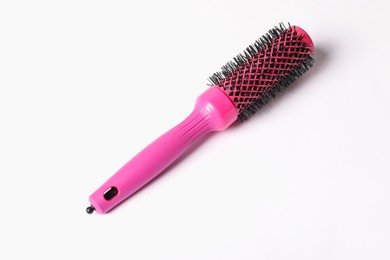 Photo of Hairdresser tool. Round pink brush on white background