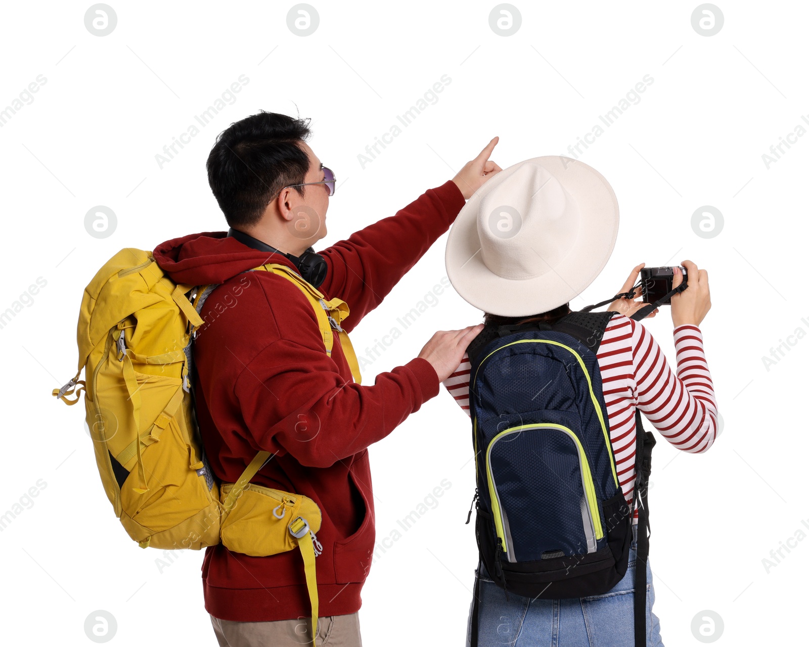 Photo of Travellers with backpacks taking photo on white background, back view