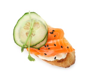 Photo of Delicious bruschetta with cream cheese, salmon and cucumber isolated on white, top view