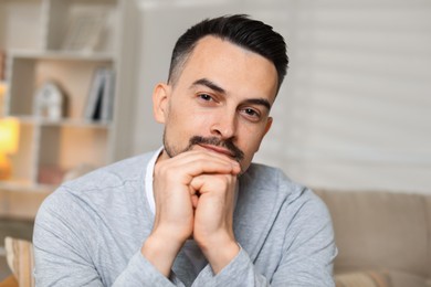 Photo of Portrait of handsome middle aged man indoors