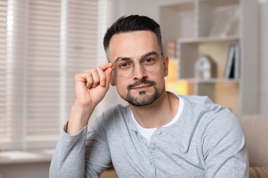 Photo of Portrait of handsome middle aged man indoors