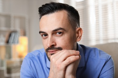 Photo of Portrait of handsome middle aged man indoors