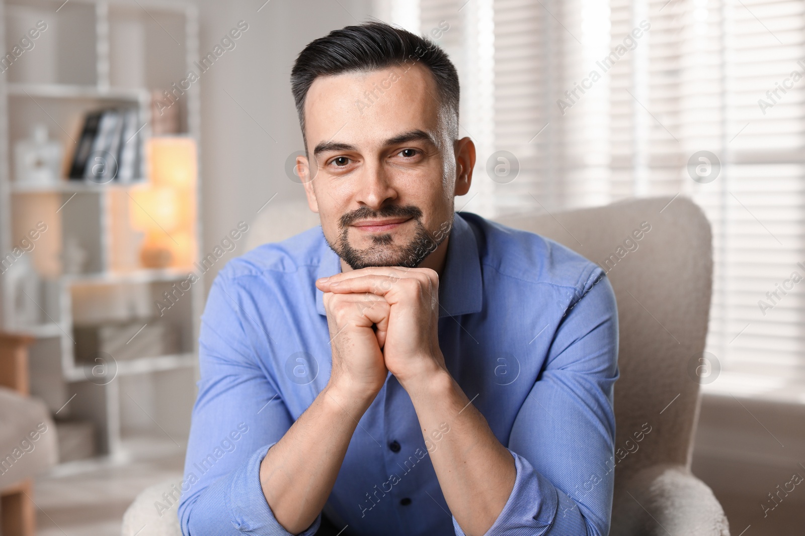 Photo of Portrait of handsome middle aged man indoors