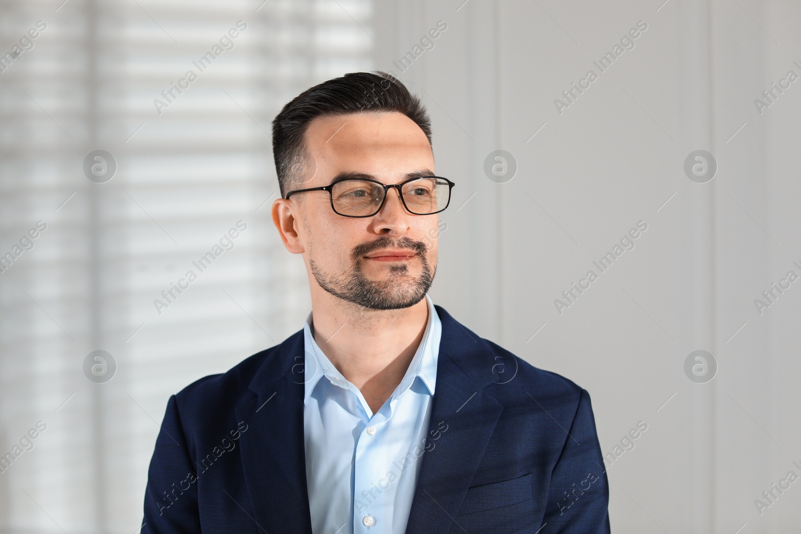 Photo of Portrait of handsome middle aged man indoors