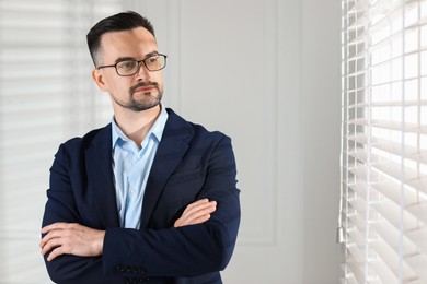 Photo of Portrait of handsome middle aged man indoors, space for text