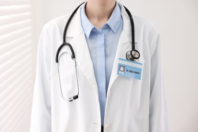 Photo of Doctor with badge in clinic, closeup view