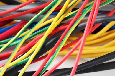 Photo of Many colorful electrical wires as background, closeup