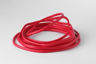 Photo of Insulated red electrical wire isolated on white