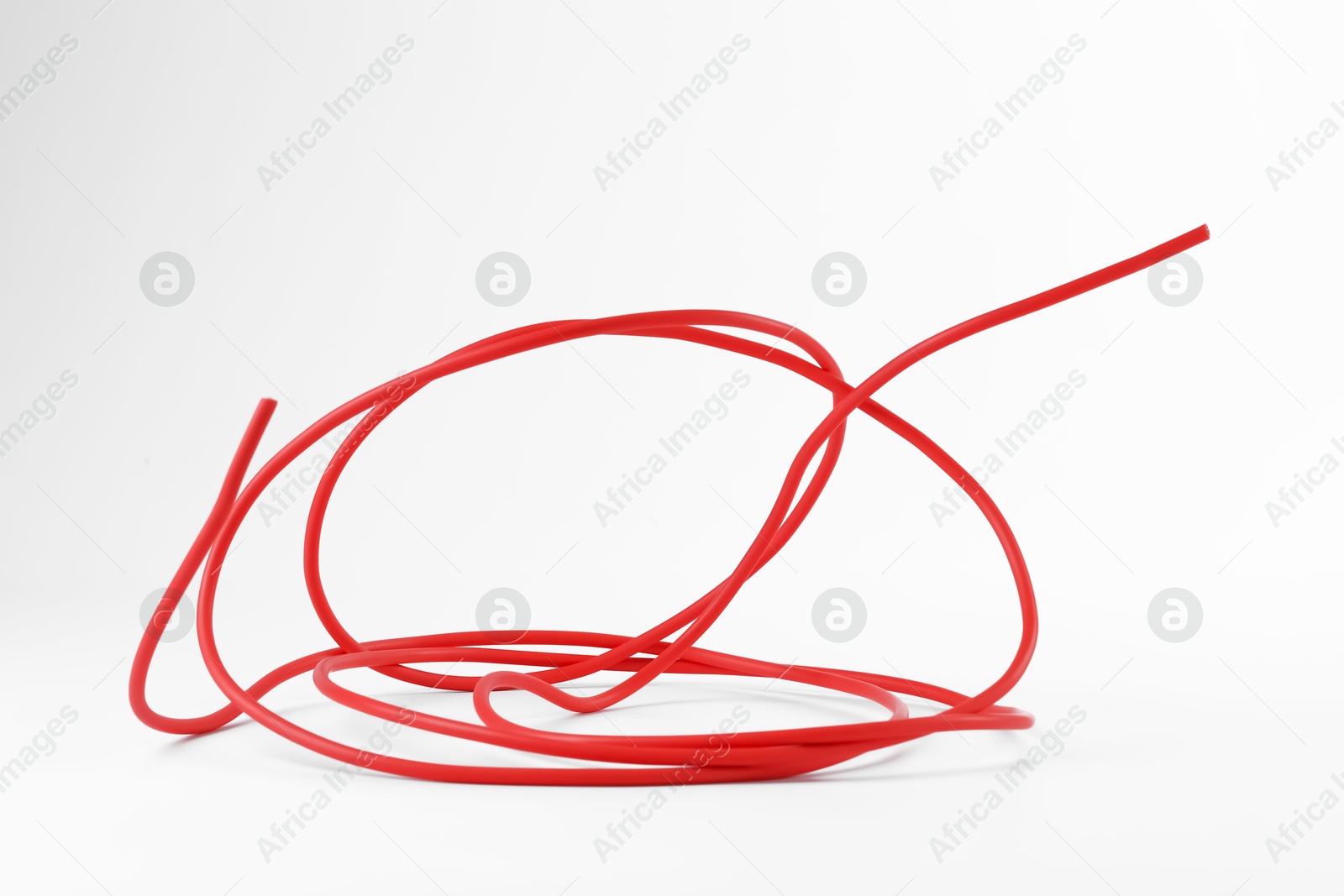 Photo of Insulated red electrical wire isolated on white