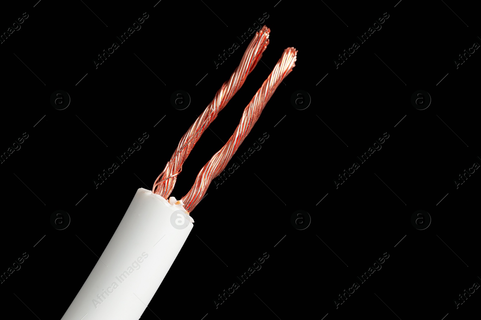 Photo of White stripped electrical wire on black background, closeup