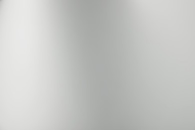 Photo of Light grey gradient background. Abstract color backdrop for design