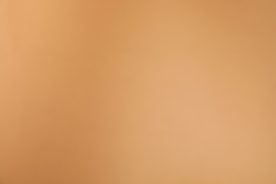 Photo of Light brown gradient background. Abstract color backdrop for design