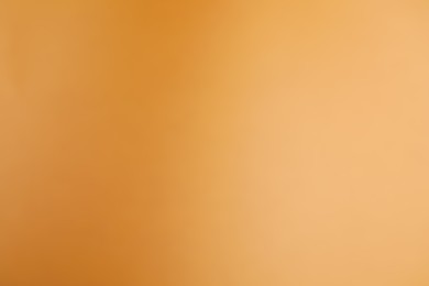 Photo of Light brown gradient background. Abstract color backdrop for design