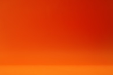 Photo of Orange gradient background. Abstract color backdrop for design