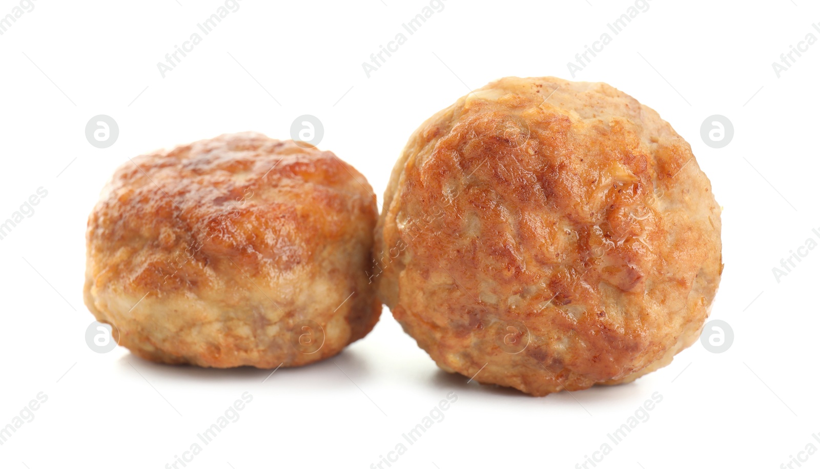 Photo of Two tasty cooked meatballs isolated on white