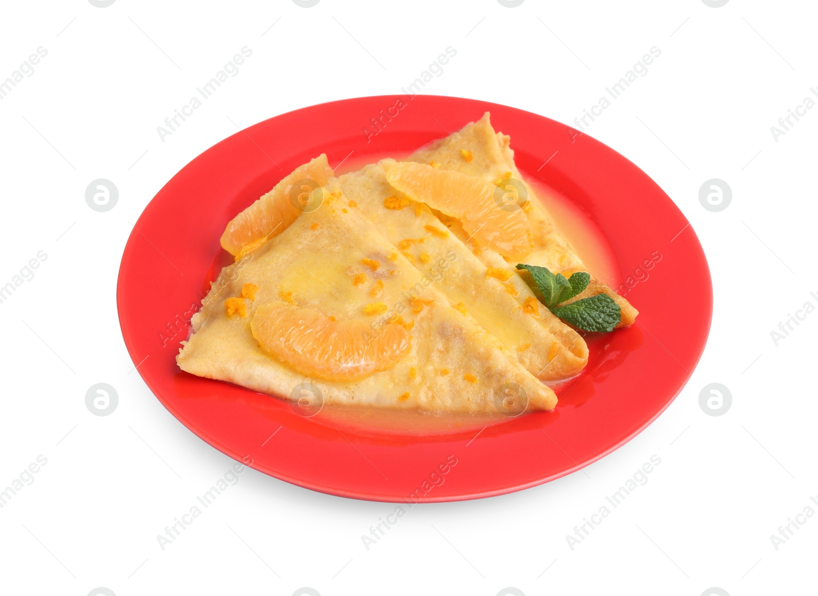 Photo of Plate with tasty crepes Suzette isolated on white