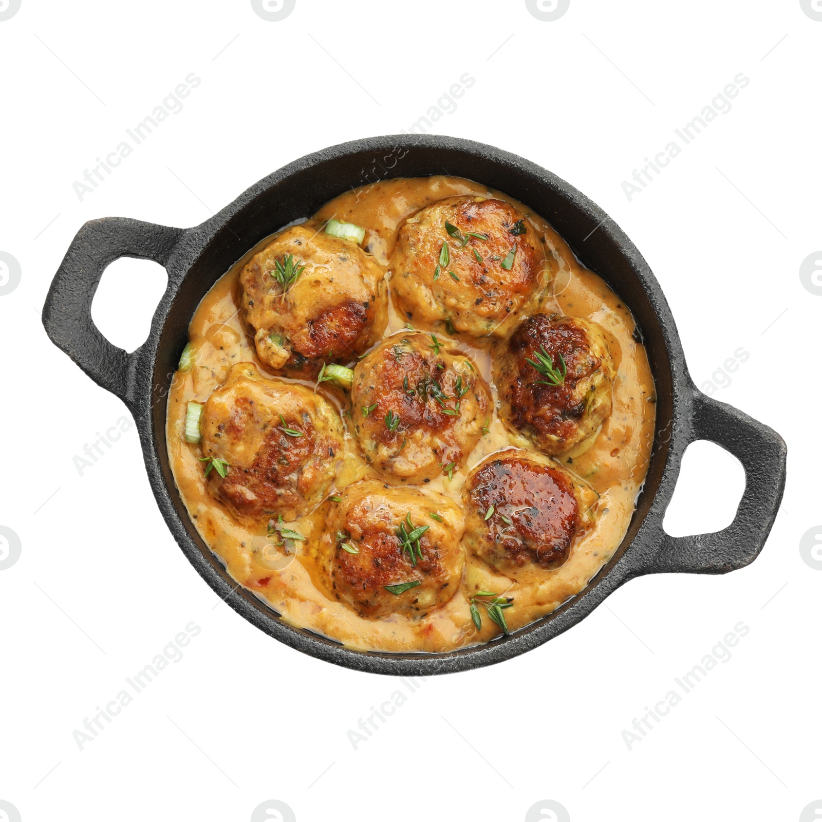 Photo of Delicious meatballs with gravy cream sauce and herbs isolated on white, top view