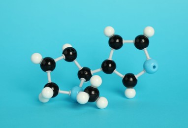 Photo of Chemical model of molecule on light blue background