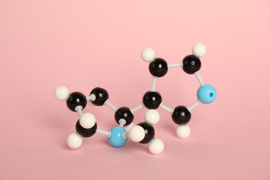 Photo of Chemical model of molecule on pink background