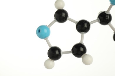 Photo of Chemical model of molecule on white background, closeup. Space for text