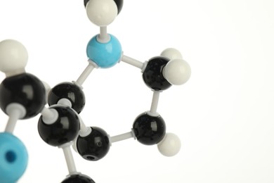 Photo of Chemical model of molecule on white background, closeup. Space for text