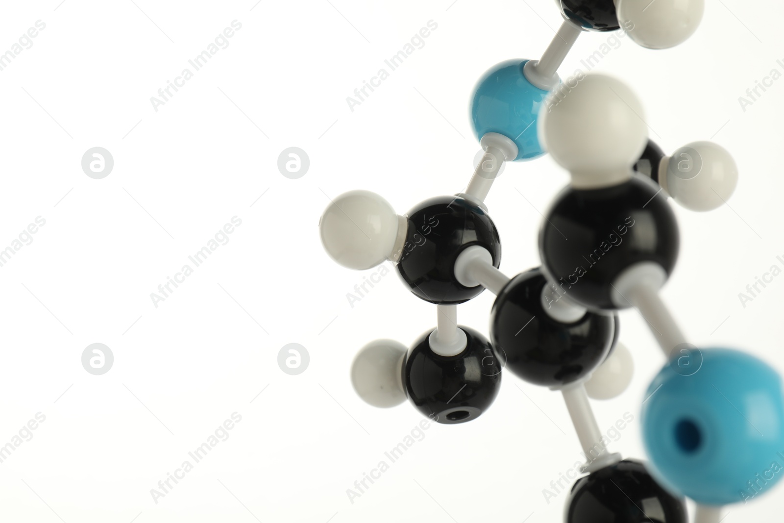 Photo of Chemical model of molecule on white background, closeup. Space for text