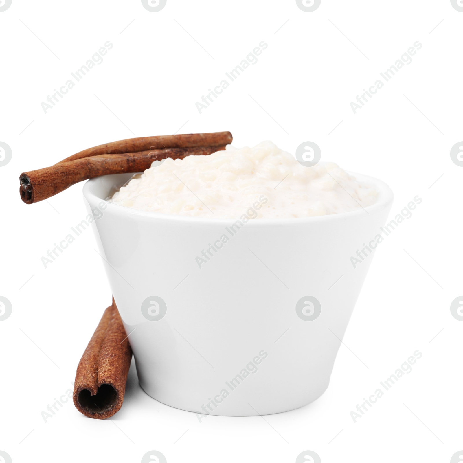 Photo of Tasty rice pudding with cinnamon isolated on white