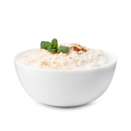 Photo of Tasty rice pudding with cinnamon and mint in bowl isolated on white