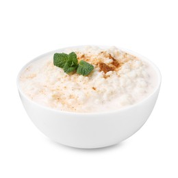 Photo of Tasty rice pudding with cinnamon and mint in bowl isolated on white