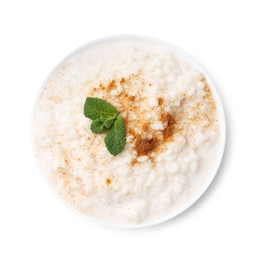 Photo of Tasty rice pudding with cinnamon and mint in bowl isolated on white, top view