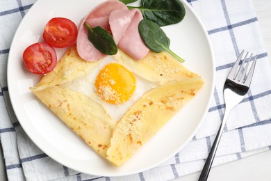 Photo of Delicious crepe with egg, ham and parmesan cheese served on table, flat lay