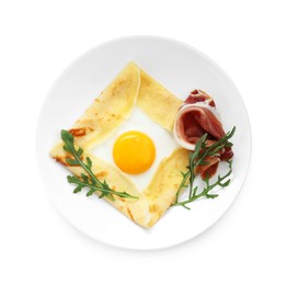 Photo of Delicious crepe bretonne with bacon and arugula isolated on white, top view