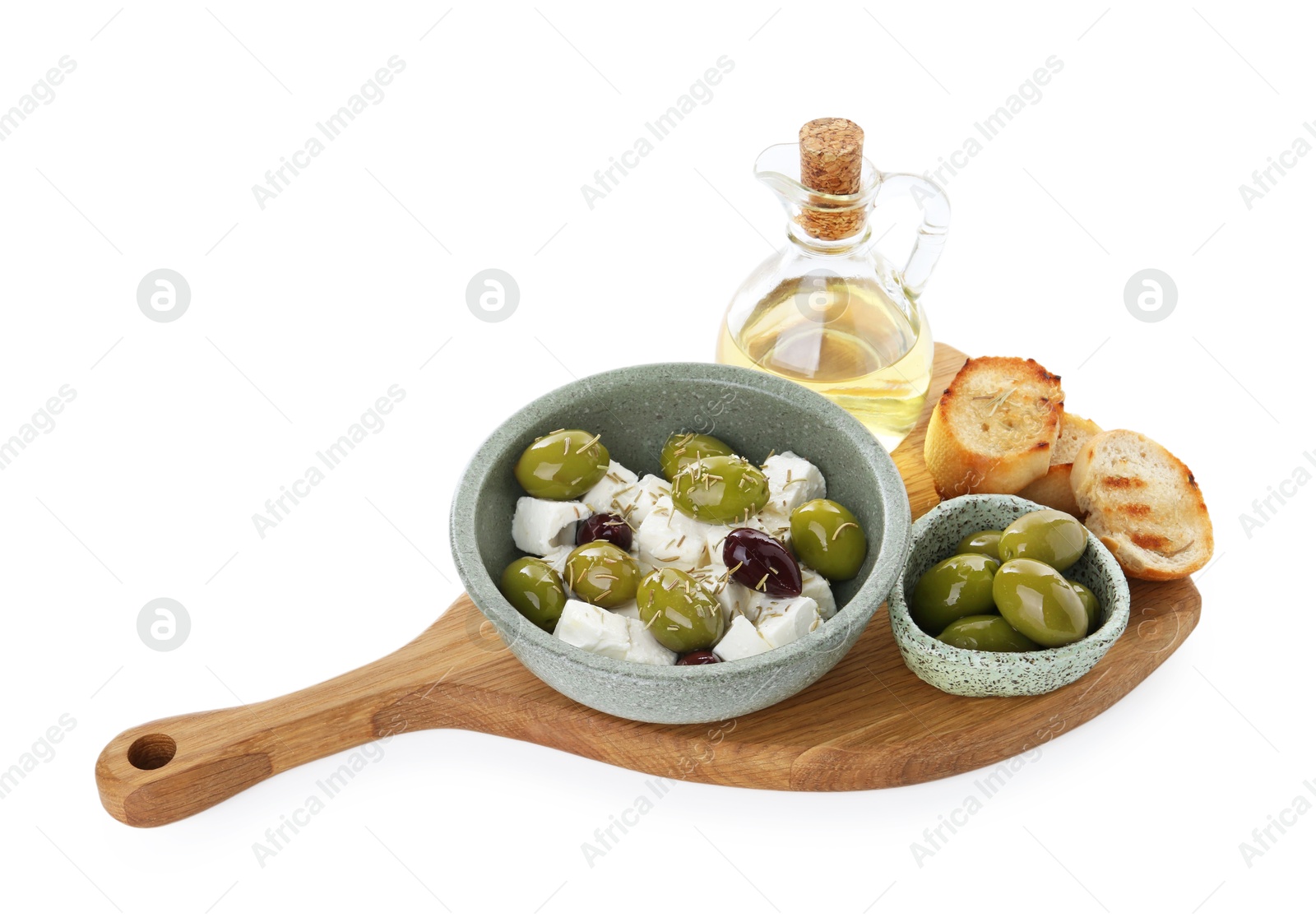 Photo of Marinated olives, feta cheese, bread pieces and oil isolated on white