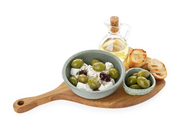 Photo of Marinated olives, feta cheese, bread pieces and oil isolated on white