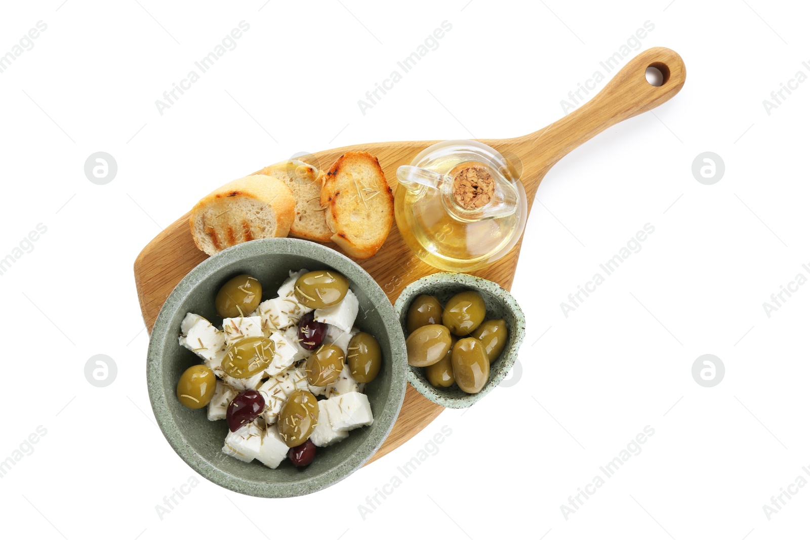 Photo of Marinated olives, feta cheese, bread pieces and oil isolated on white, top view