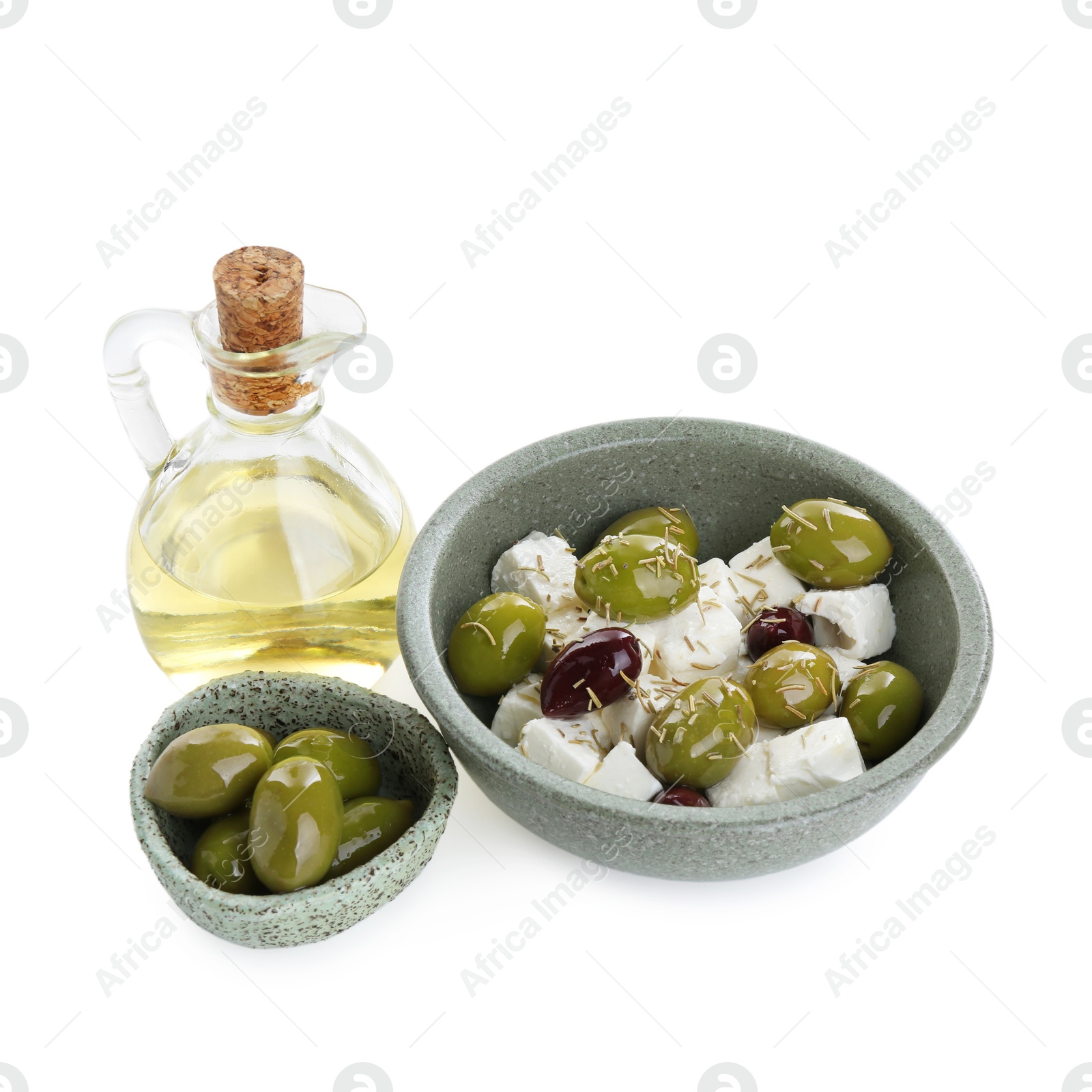 Photo of Marinated olives, feta cheese and oil isolated on white