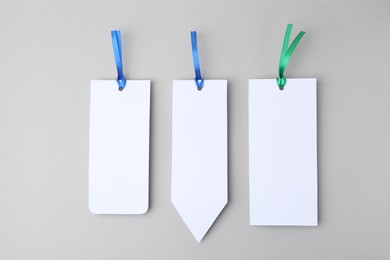 Photo of Paper bookmarks on light grey background, top view