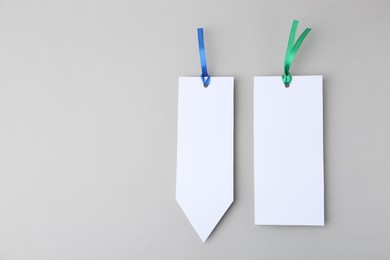 Photo of Paper bookmarks on light grey background, top view. Space for text