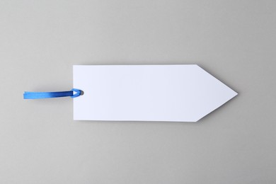 Photo of One paper bookmark on light grey background, top view