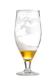 Photo of Almost empty glass of beer isolated on white