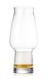 Photo of Almost empty glass of beer isolated on white