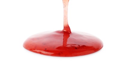 Photo of Pouring delicious strawberry sauce on white background, closeup