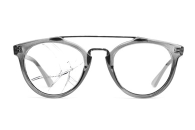 Image of Eyeglasses with one broken lens isolated on white