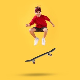 Image of Cute little boy with skateboard in air on yellow background. Performing trick