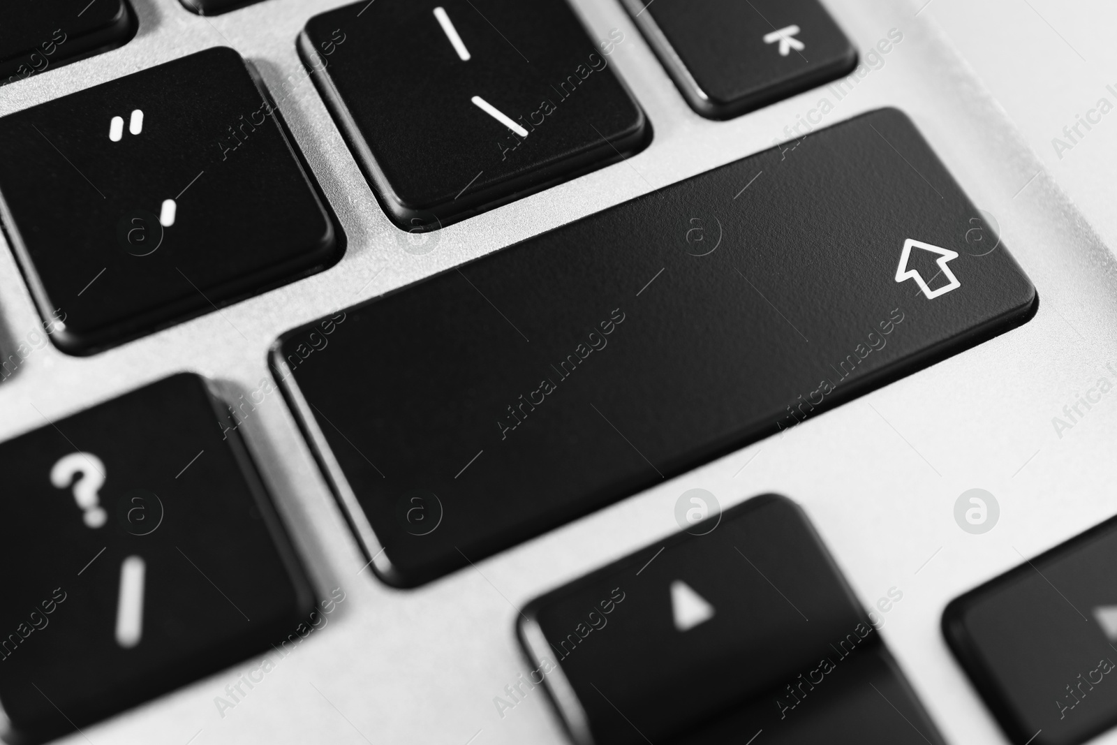 Photo of Technical support concept. Modern keyboard on light background, closeup