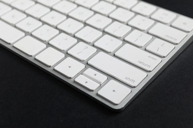 Photo of Technical support concept. Modern keyboard on black background, closeup