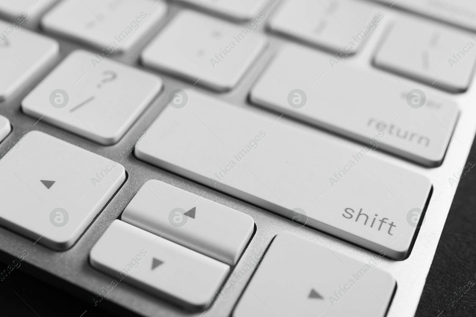 Photo of Technical support concept. Modern keyboard on black background, closeup