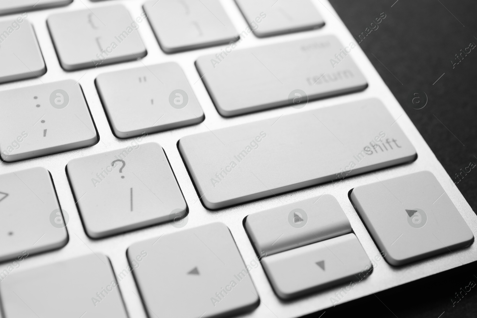 Photo of Technical support concept. Modern keyboard on black background, closeup