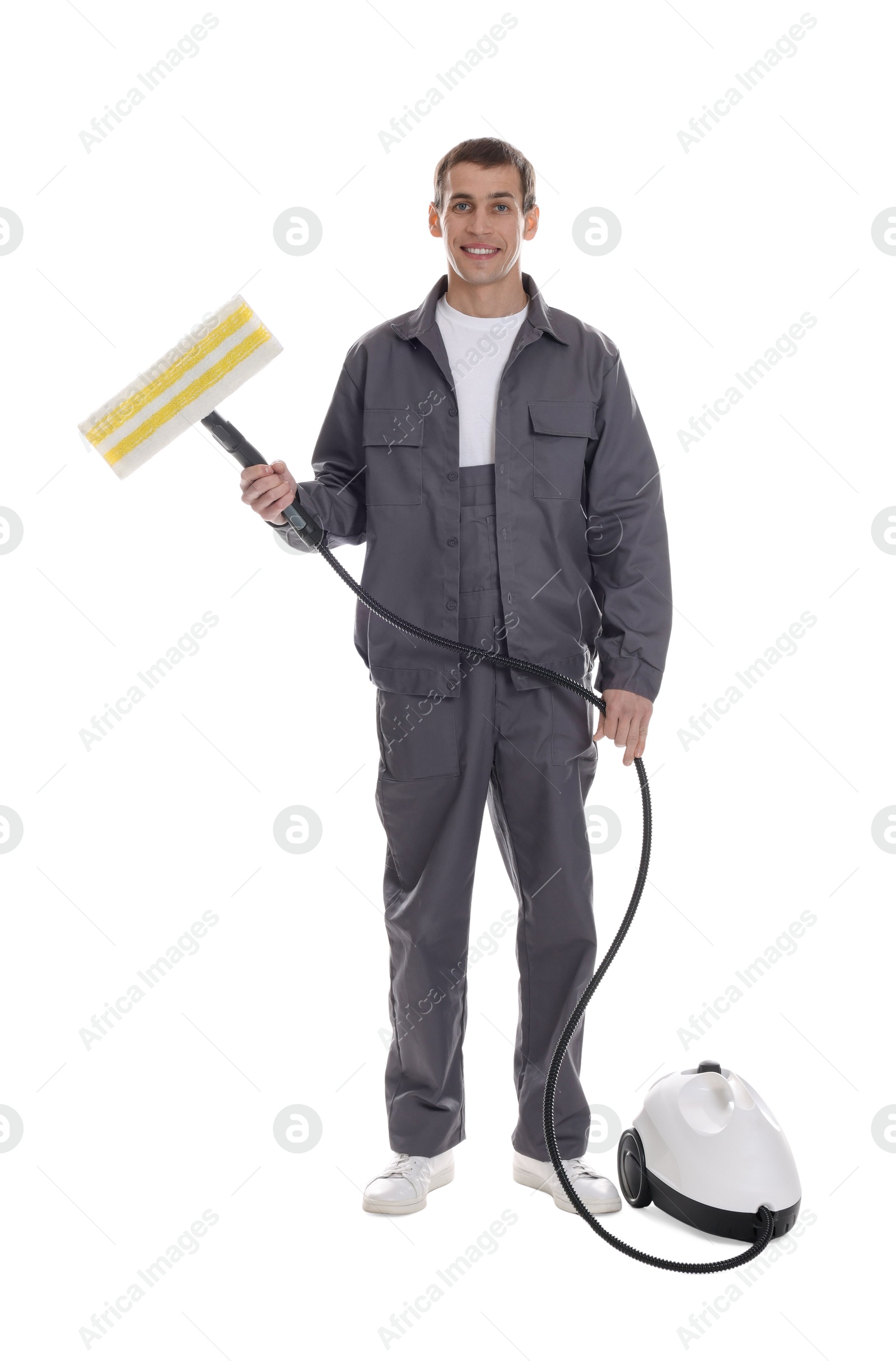 Photo of Smiling cleaning service worker with steam cleaner on white background